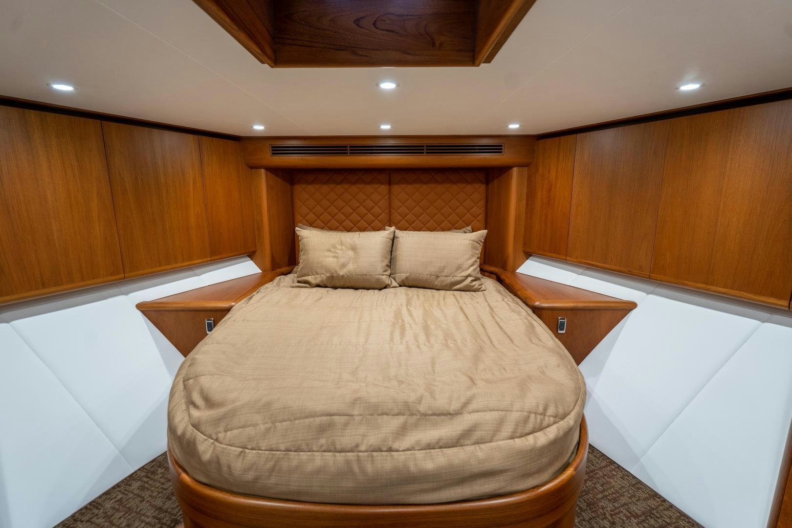 a bed in a room aboard TANGAROA Yacht for Sale
