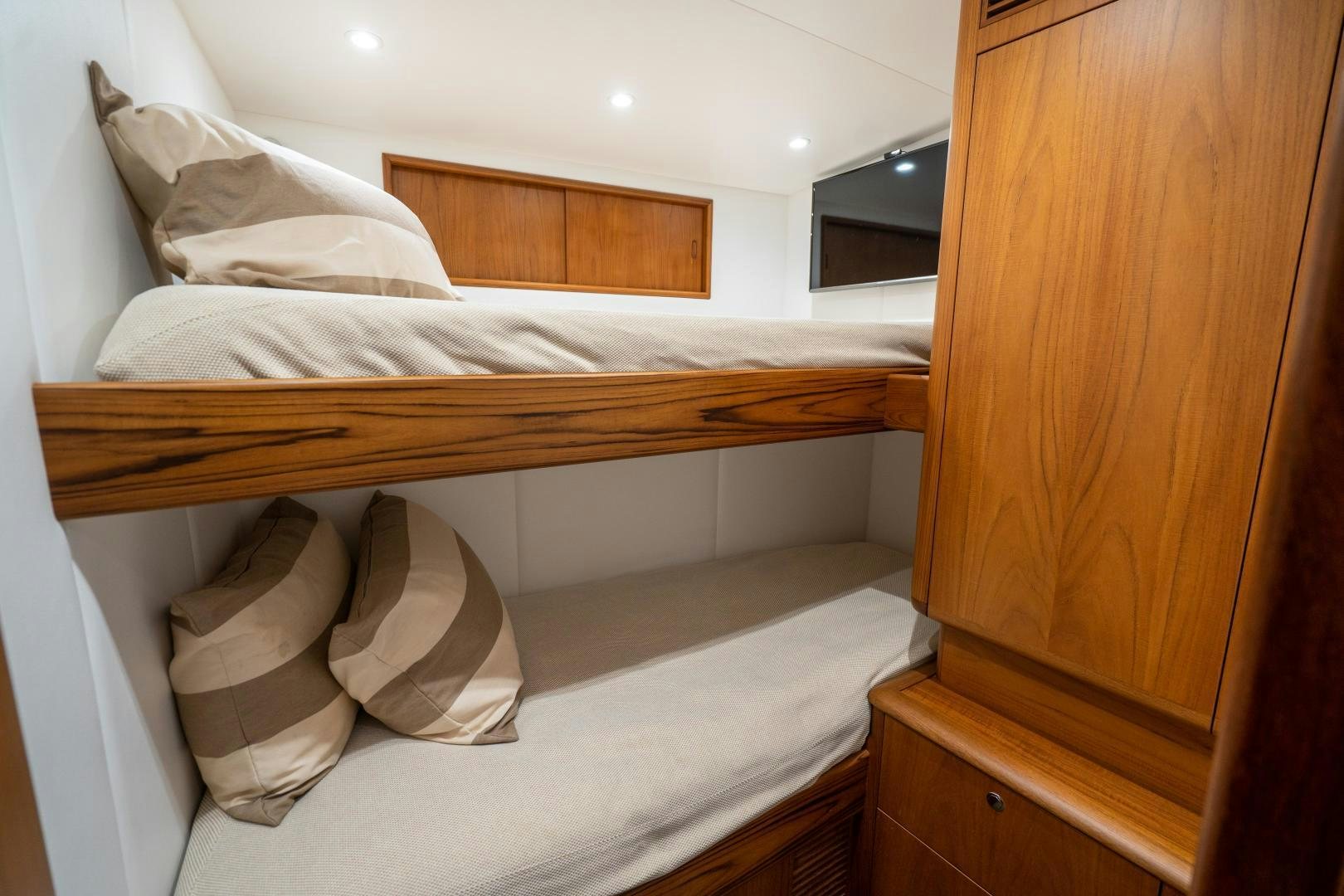 a bed with white sheets aboard TANGAROA Yacht for Sale