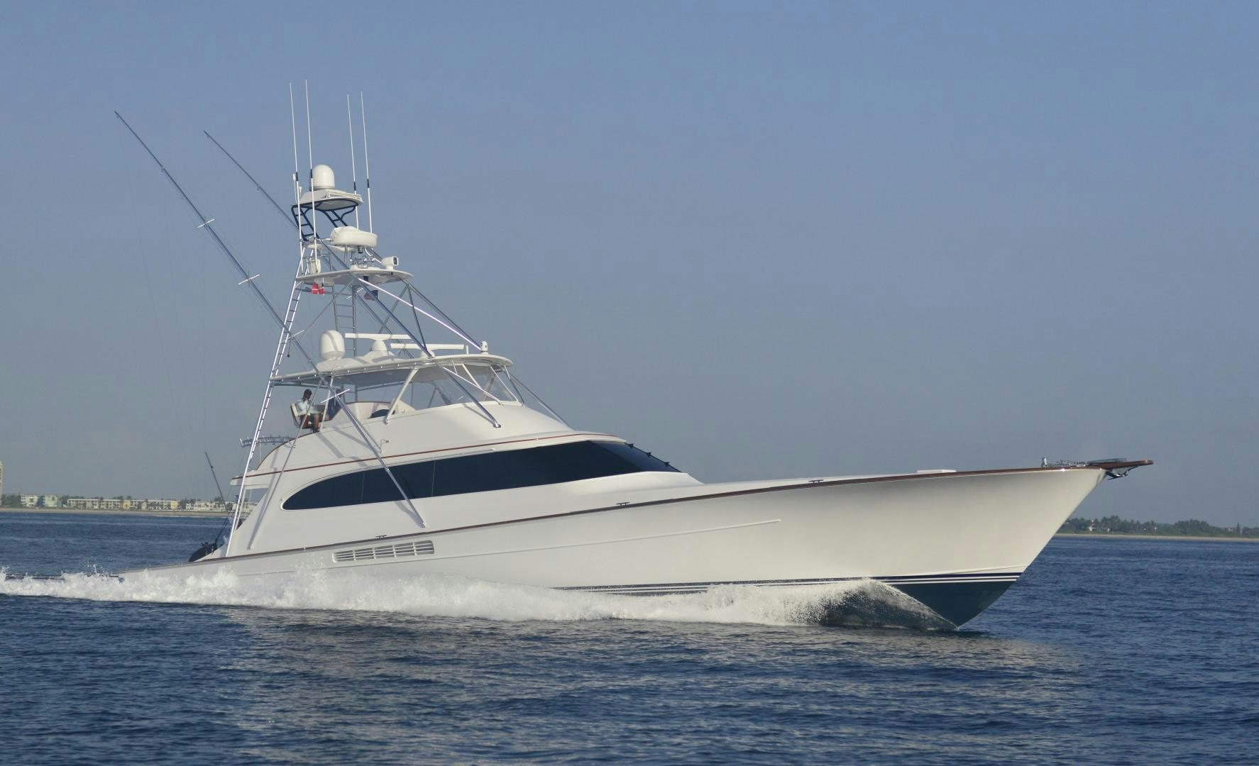 a white boat on the water aboard TANGAROA Yacht for Sale