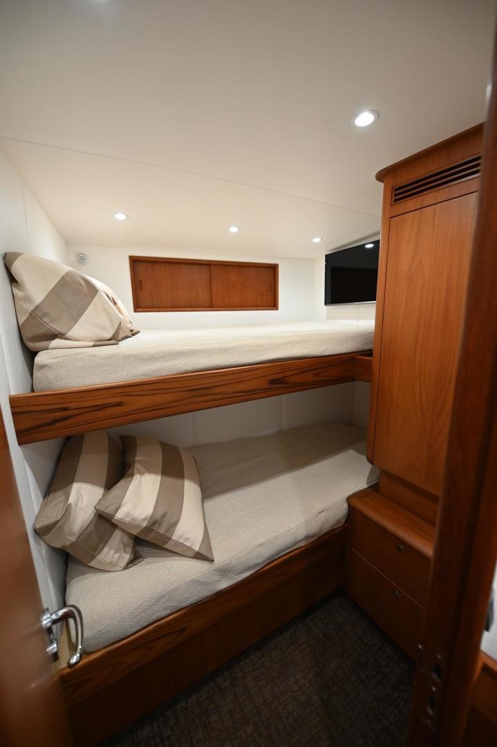a bed with white sheets aboard TANGAROA Yacht for Sale