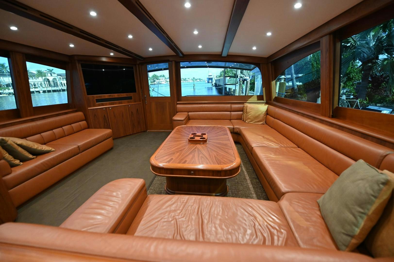 a living room with a couch and a table aboard TANGAROA Yacht for Sale