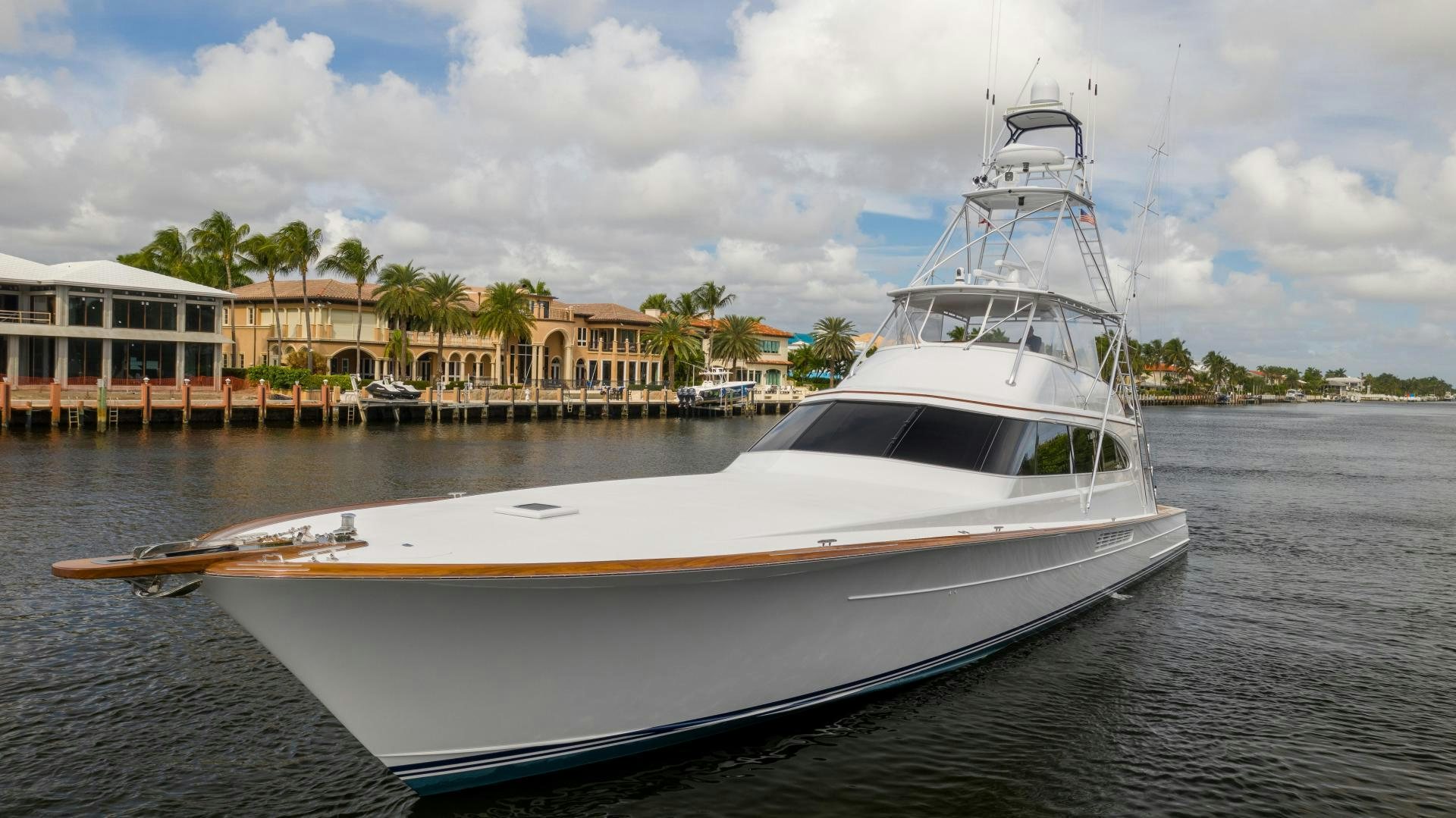 a white yacht in the water aboard TANGAROA Yacht for Sale