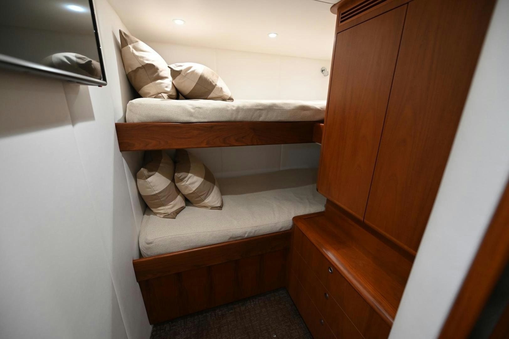 a bed with white sheets aboard TANGAROA Yacht for Sale