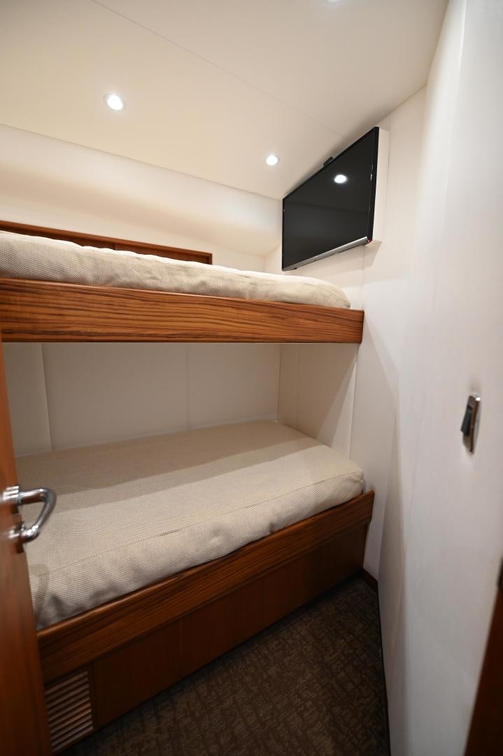 a bed with a television on top of it aboard TANGAROA Yacht for Sale