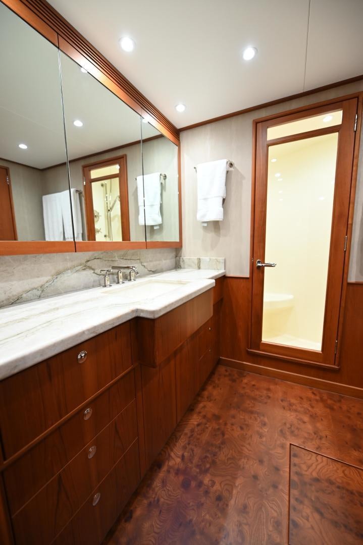 a bathroom with a large mirror aboard TANGAROA Yacht for Sale