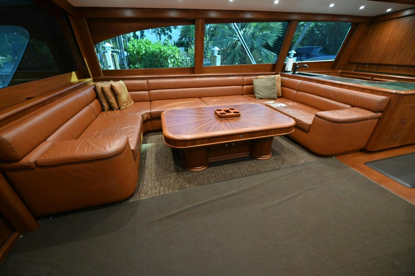 a room with couches and a table aboard TANGAROA Yacht for Sale