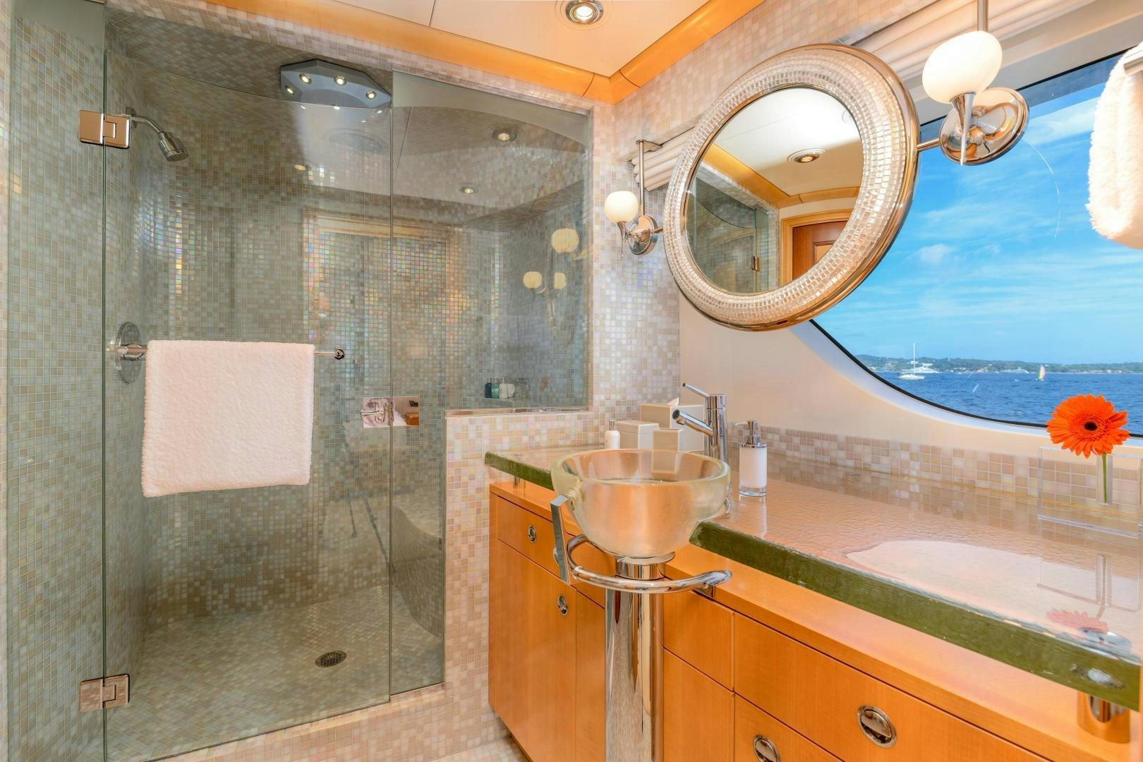 a bathroom with a glass shower aboard VICTORIA DEL MAR Yacht for Sale
