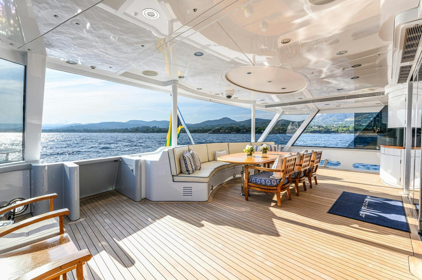 a room with a table and chairs aboard VICTORIA DEL MAR Yacht for Sale