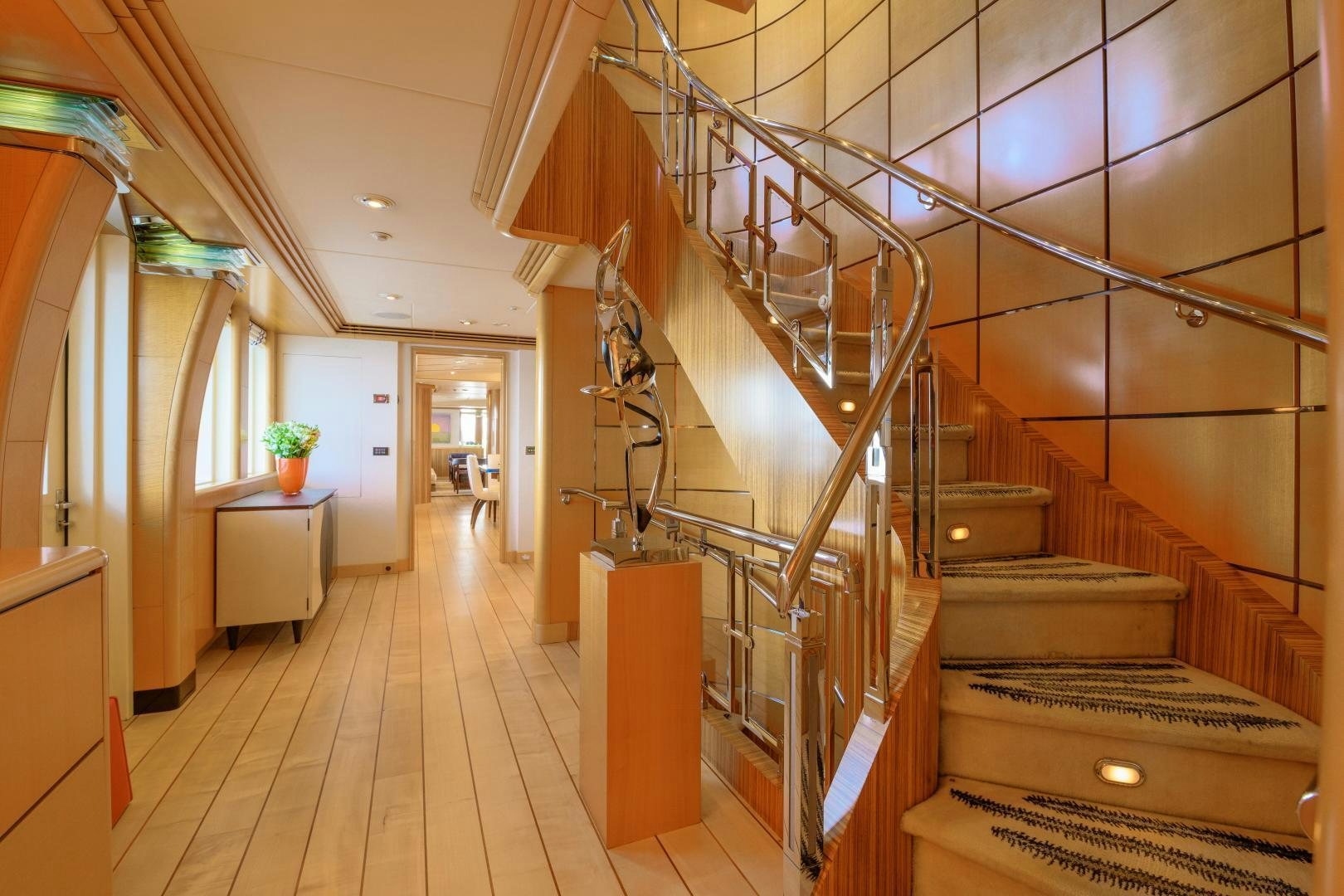 a room with wooden stairs aboard VICTORIA DEL MAR Yacht for Sale