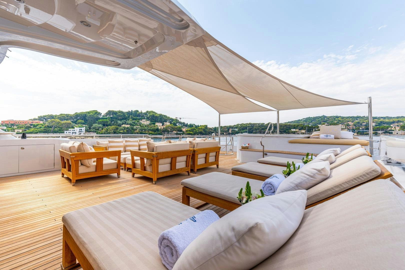 a room with a bed and a table aboard VICTORIA DEL MAR Yacht for Sale