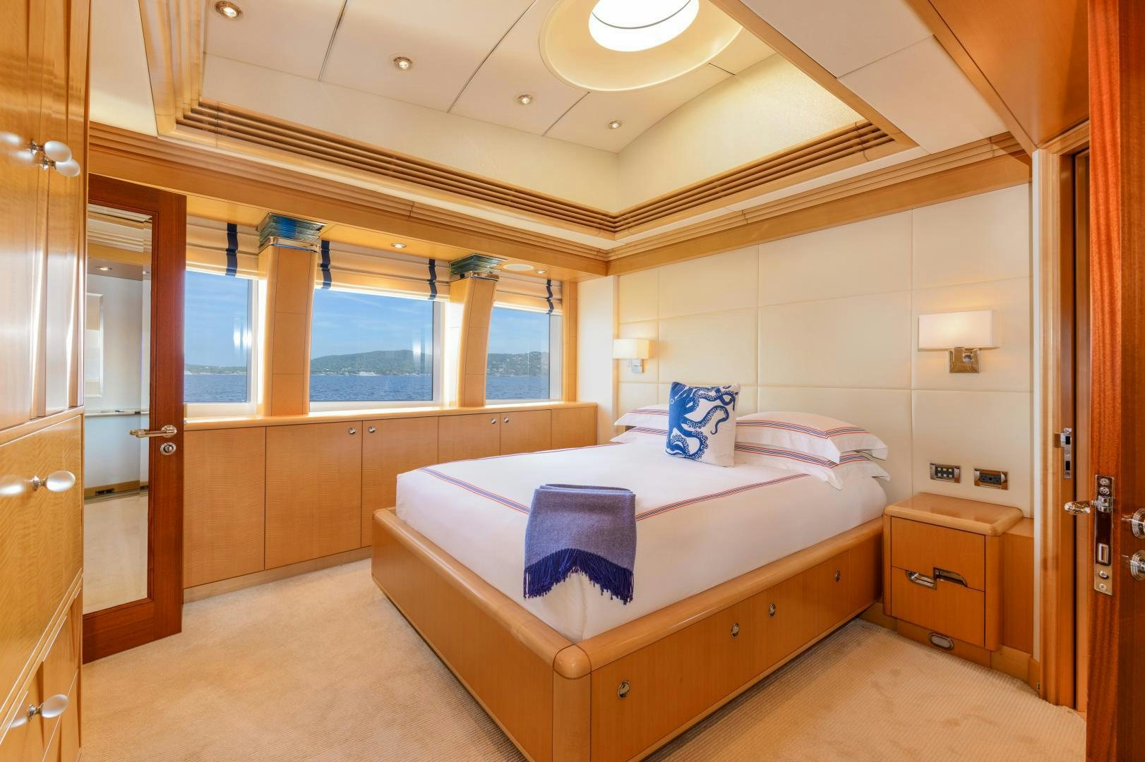 a room with a bed and a window aboard VICTORIA DEL MAR Yacht for Sale