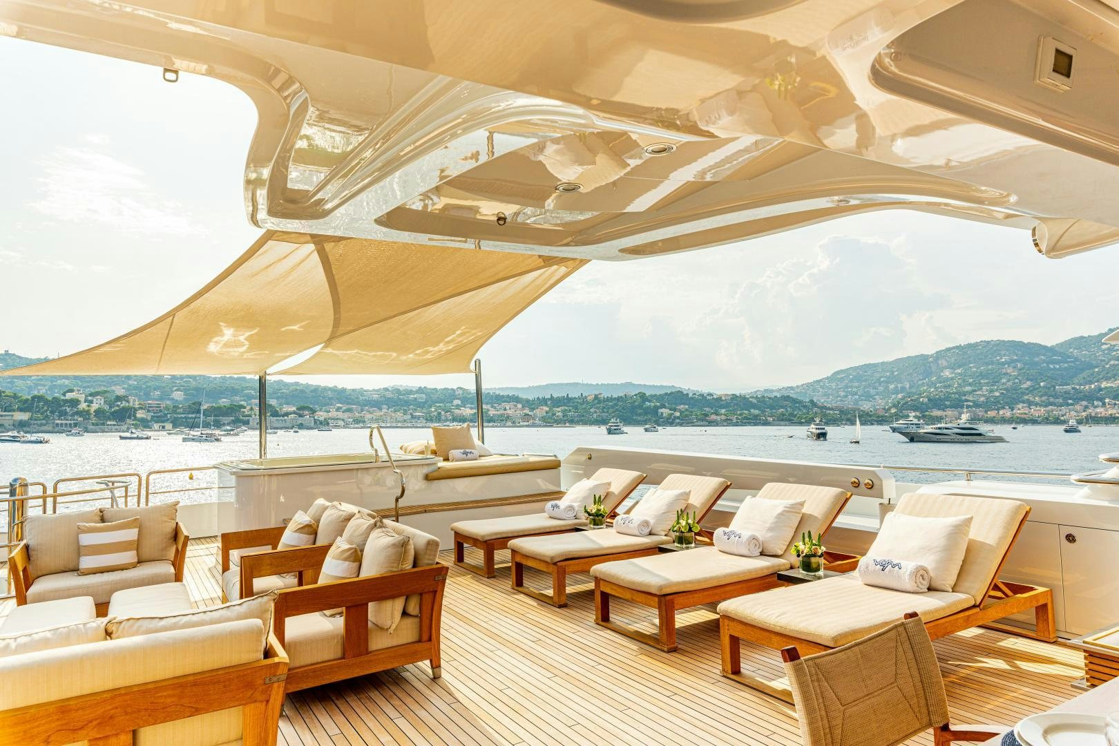 a room with tables and chairs aboard VICTORIA DEL MAR Yacht for Sale