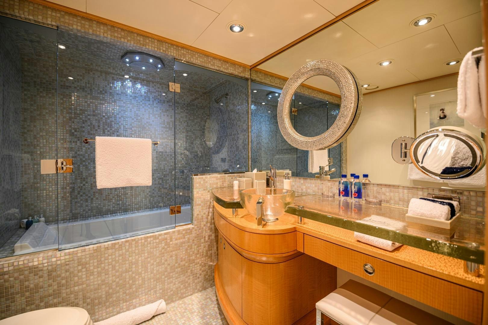 a bathroom with a large glass shower aboard VICTORIA DEL MAR Yacht for Sale