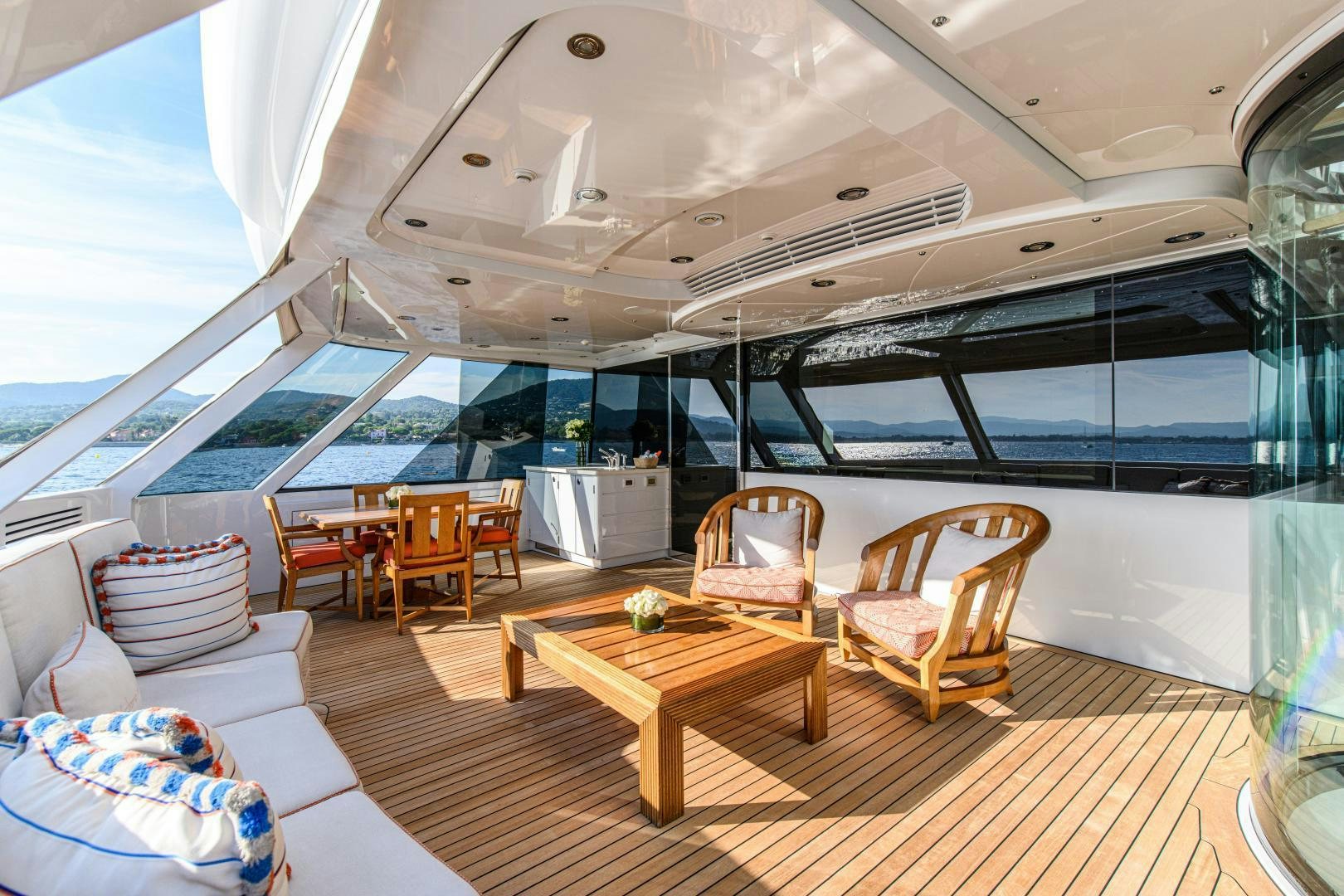 a room with a table chairs and a large window aboard VICTORIA DEL MAR Yacht for Sale