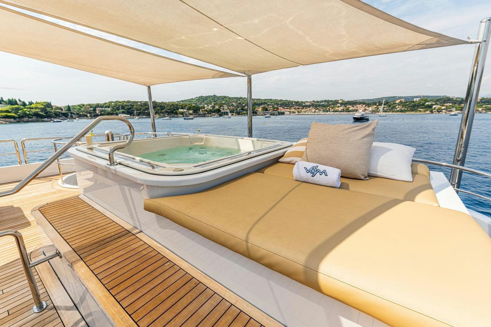 a deck with a large bed and pillows on it aboard VICTORIA DEL MAR Yacht for Sale