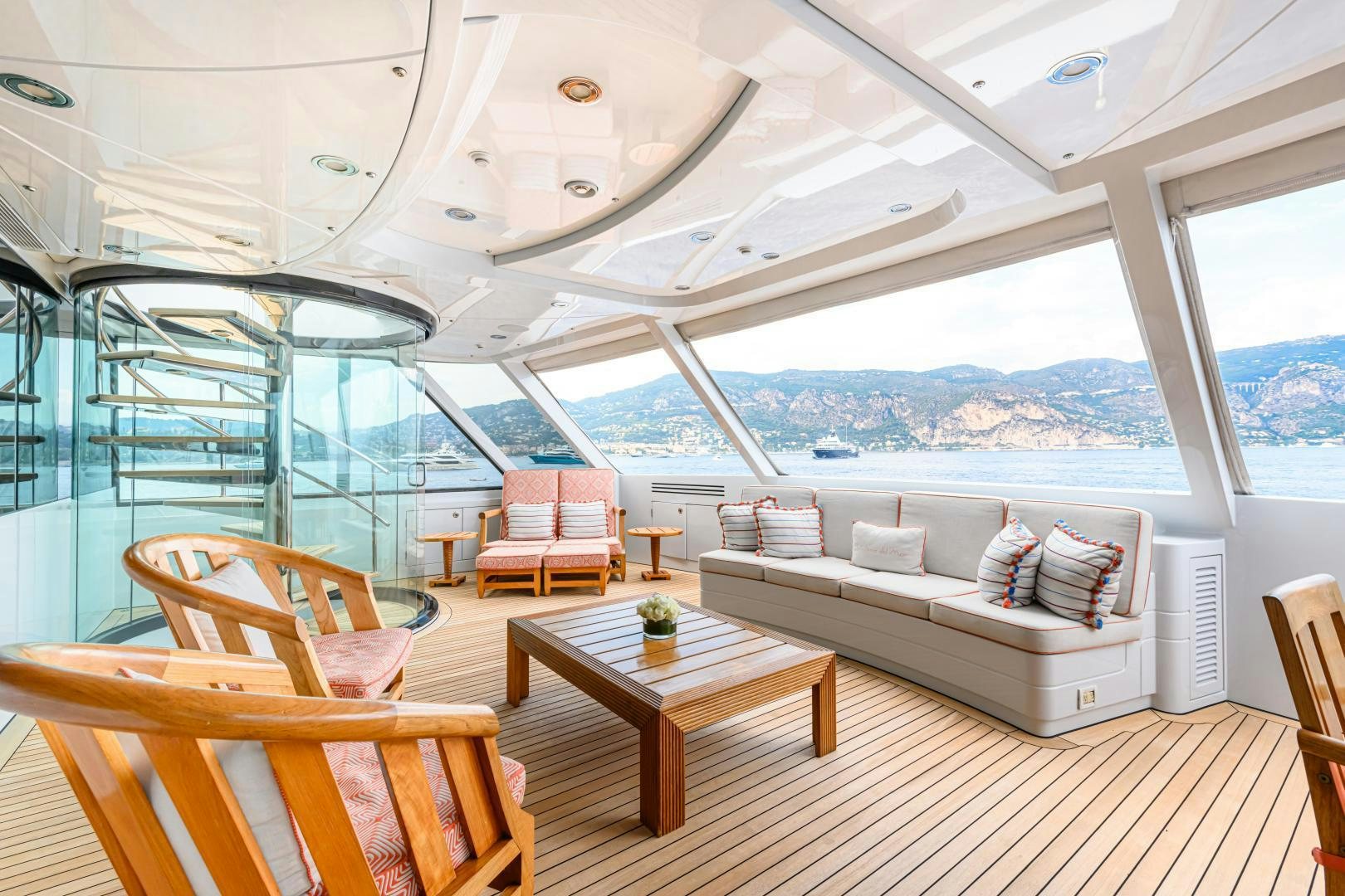 a room with a couch and a table and chairs aboard VICTORIA DEL MAR Yacht for Sale