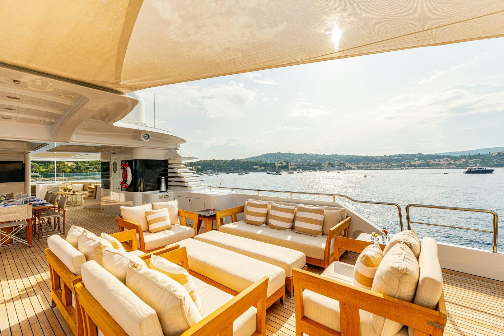a room with chairs and tables aboard VICTORIA DEL MAR Yacht for Sale