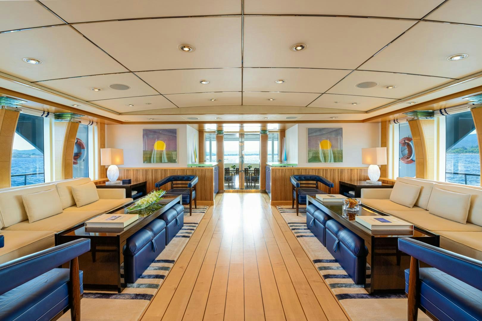 a large living room with a wood floor aboard VICTORIA DEL MAR Yacht for Sale