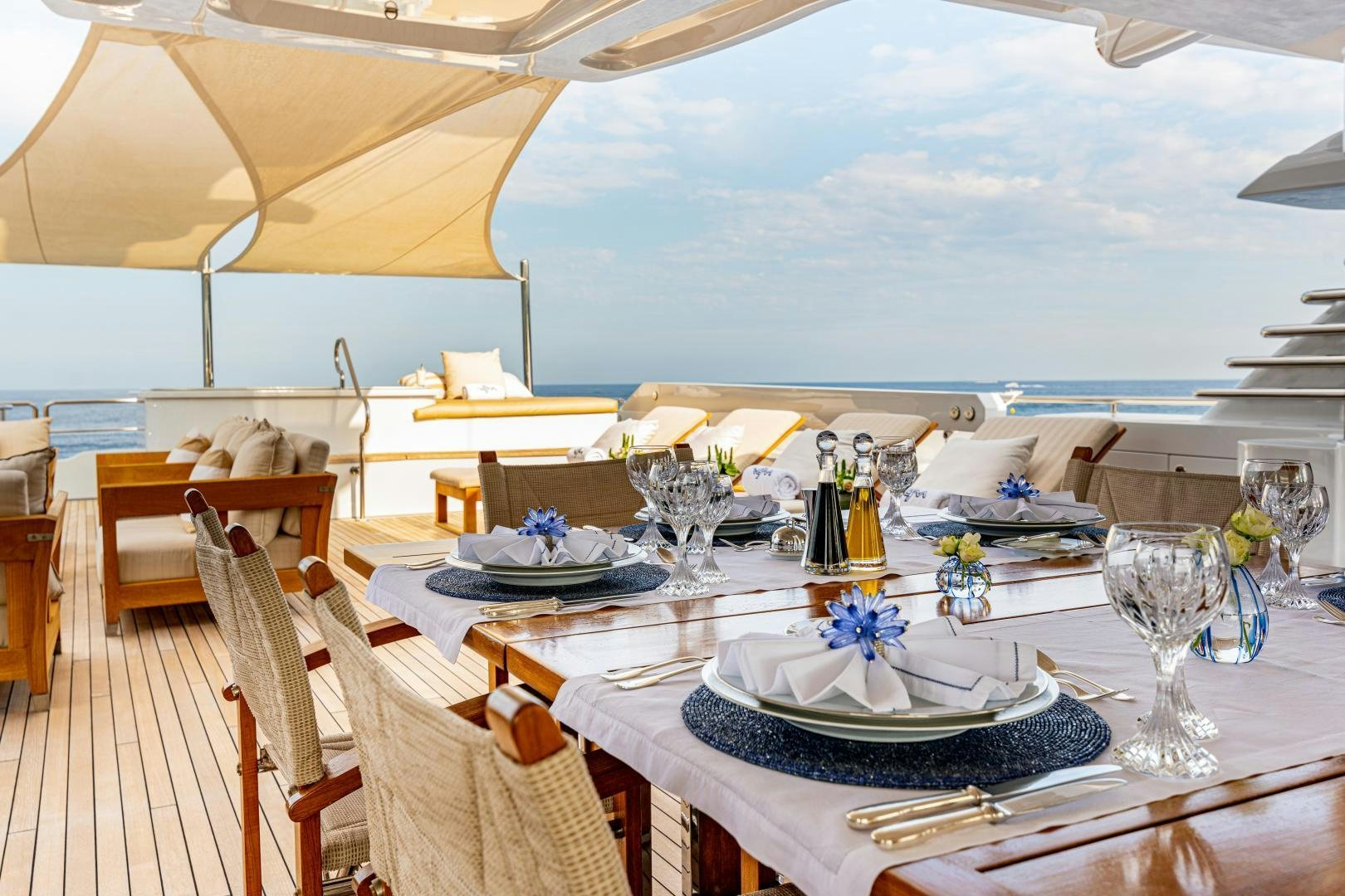 a table set for a dinner aboard VICTORIA DEL MAR Yacht for Sale