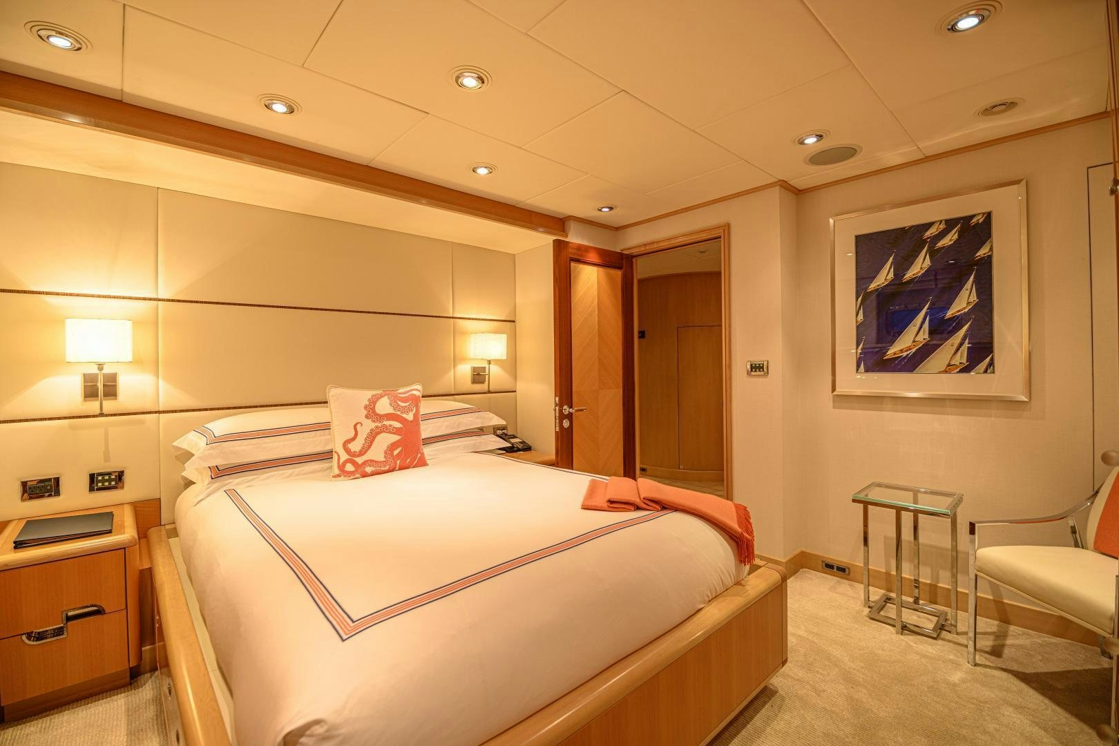 a hotel room with a bed and a chair aboard VICTORIA DEL MAR Yacht for Sale