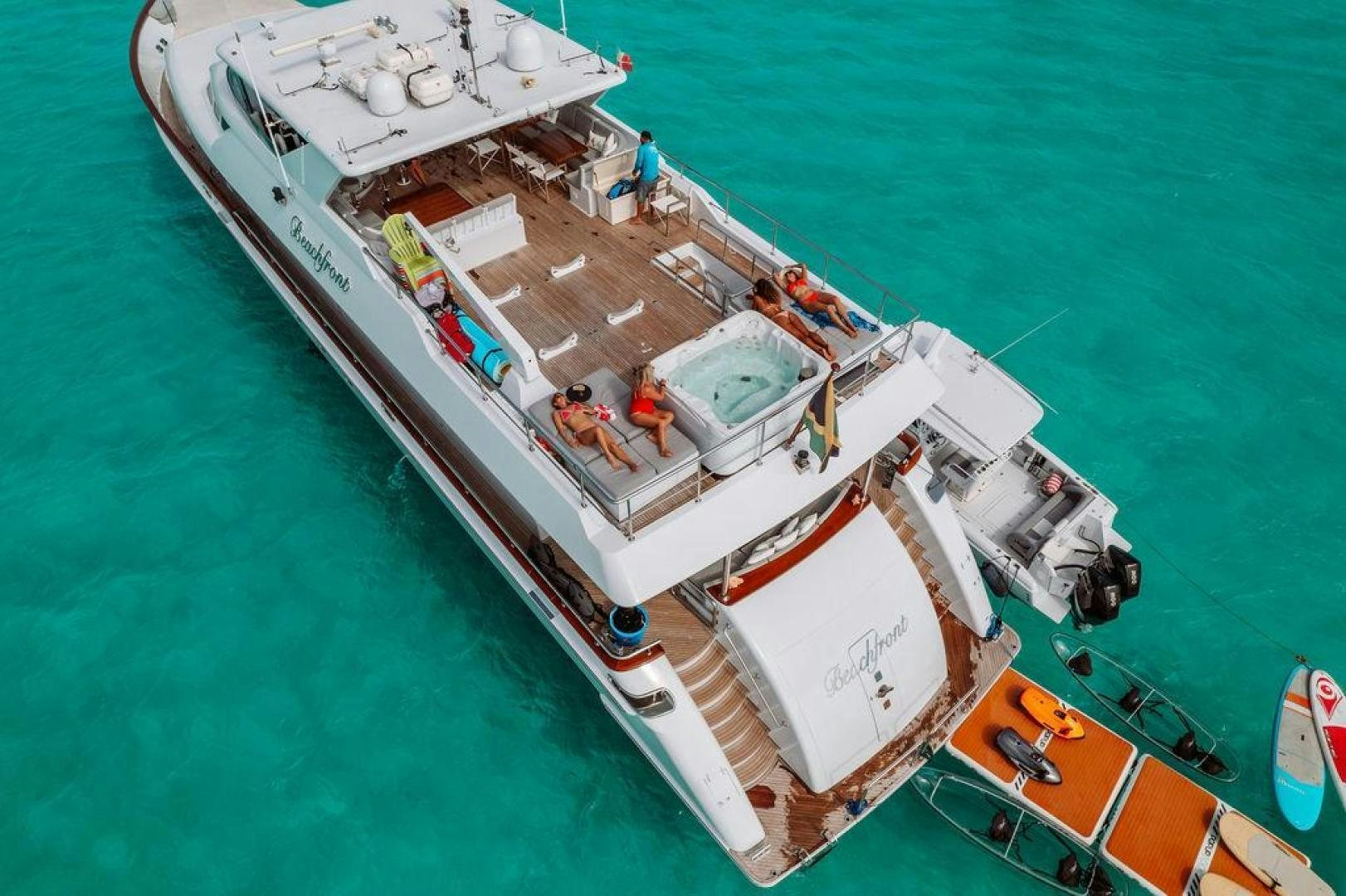 a large ship in the water aboard BEACHFRONT Yacht for Sale