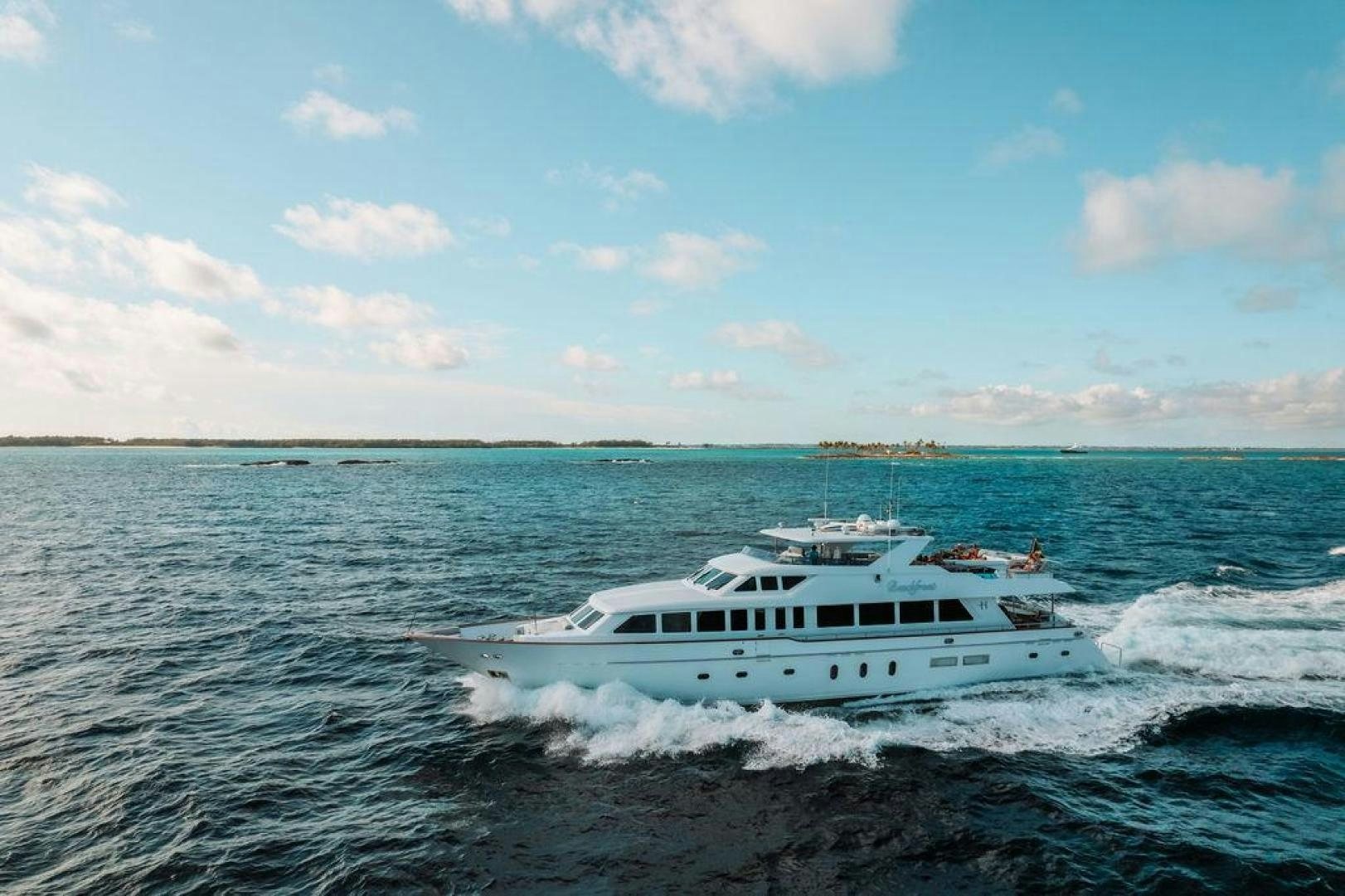 a white boat in the water aboard BEACHFRONT Yacht for Sale