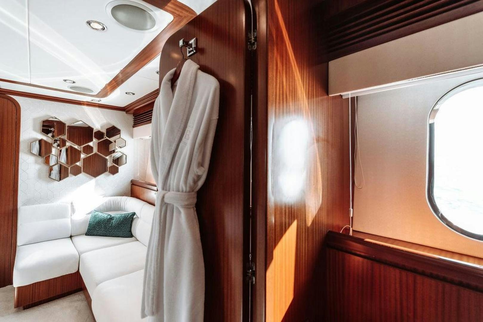 a room with a bed and a window aboard BEACHFRONT Yacht for Sale