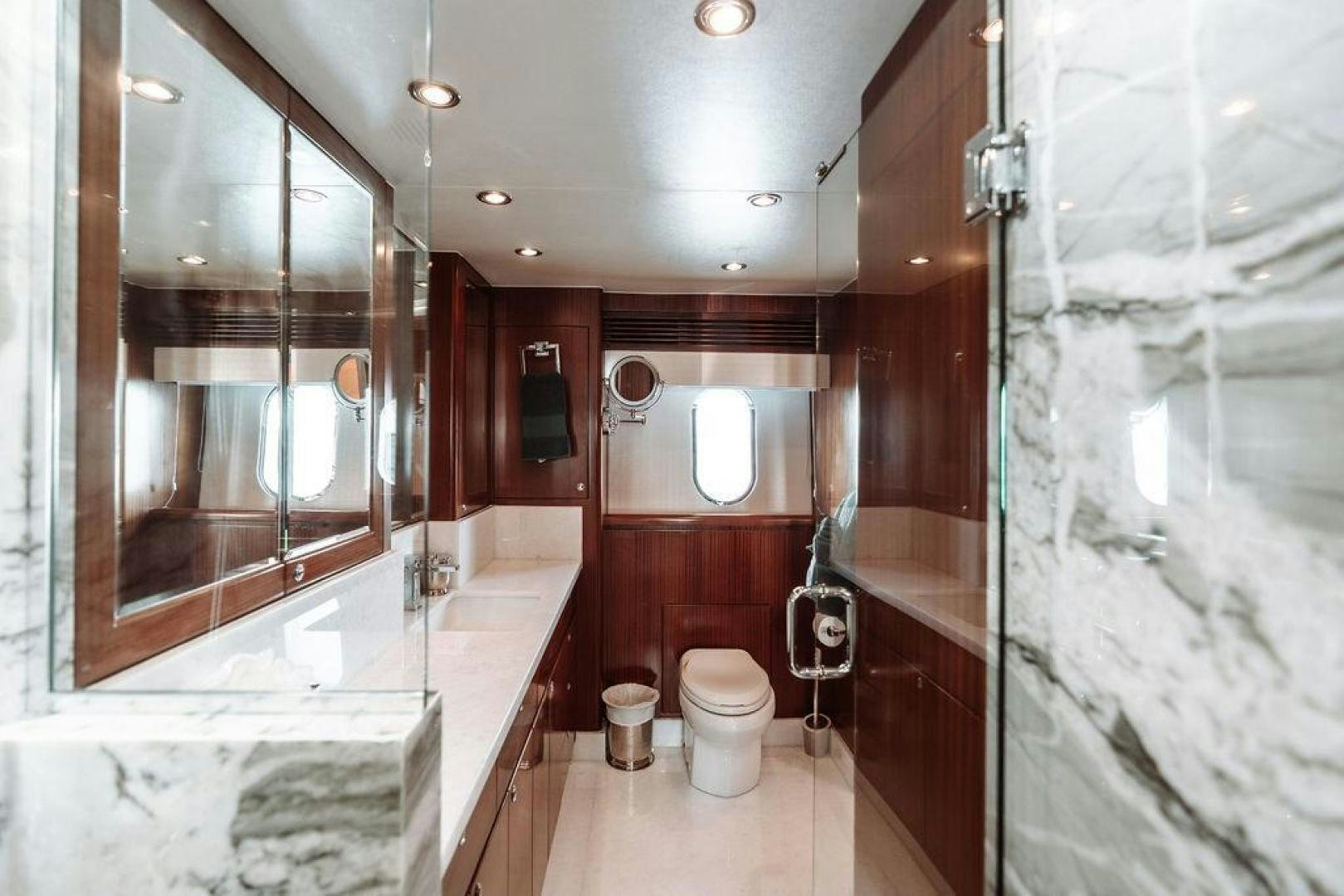 a bathroom with a tub toilet and sink aboard BEACHFRONT Yacht for Sale