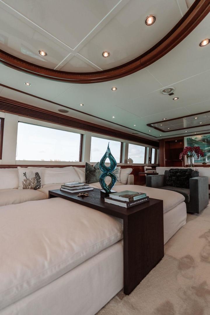 a living room with a large window aboard BEACHFRONT Yacht for Sale