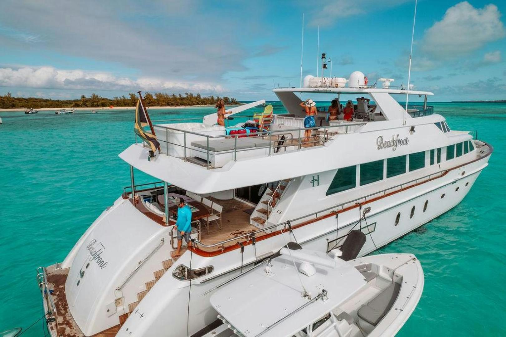 a boat with people on it aboard BEACHFRONT Yacht for Sale