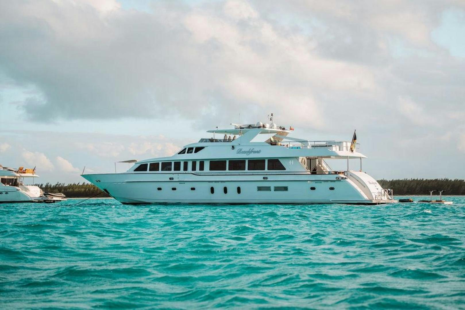 a white boat in the water aboard BEACHFRONT Yacht for Sale