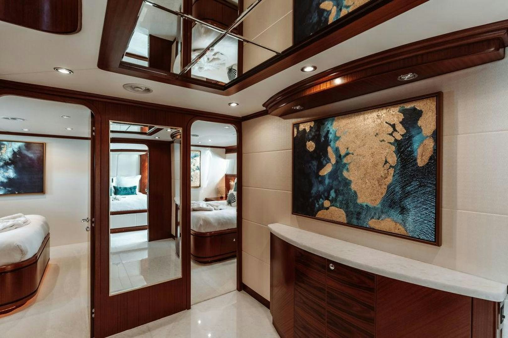 a room with a painting on the wall aboard BEACHFRONT Yacht for Sale