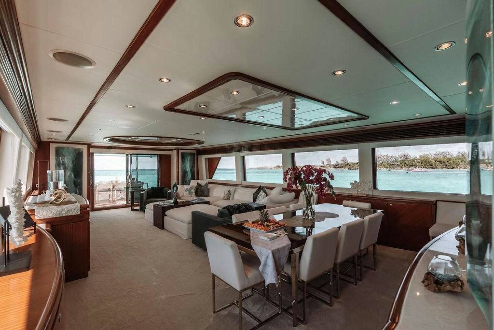 a living room with a large window aboard BEACHFRONT Yacht for Sale