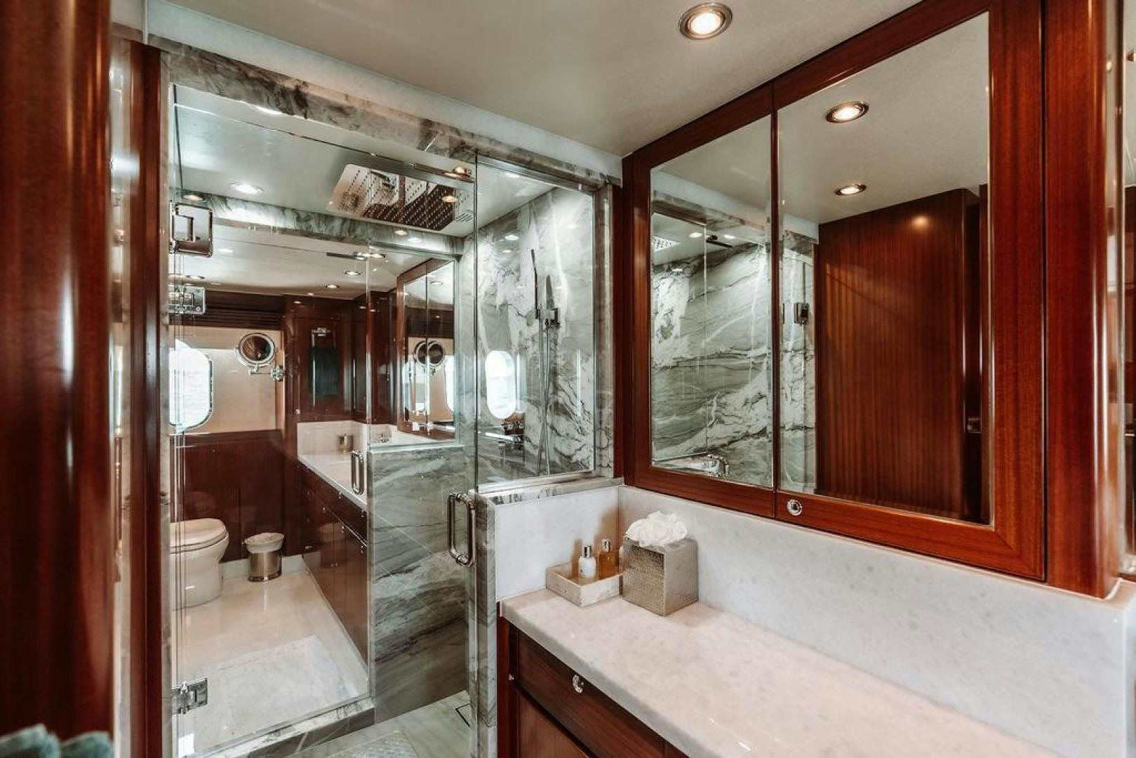 a bathroom with a large mirror aboard BEACHFRONT Yacht for Sale