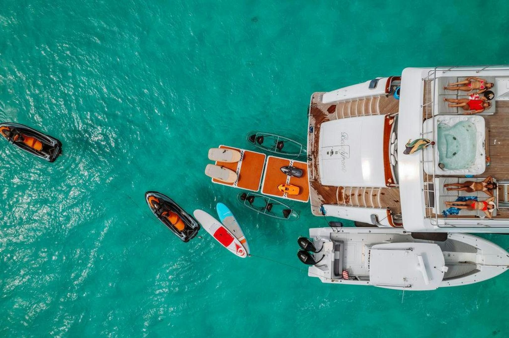 a boat with a boat on it aboard BEACHFRONT Yacht for Sale