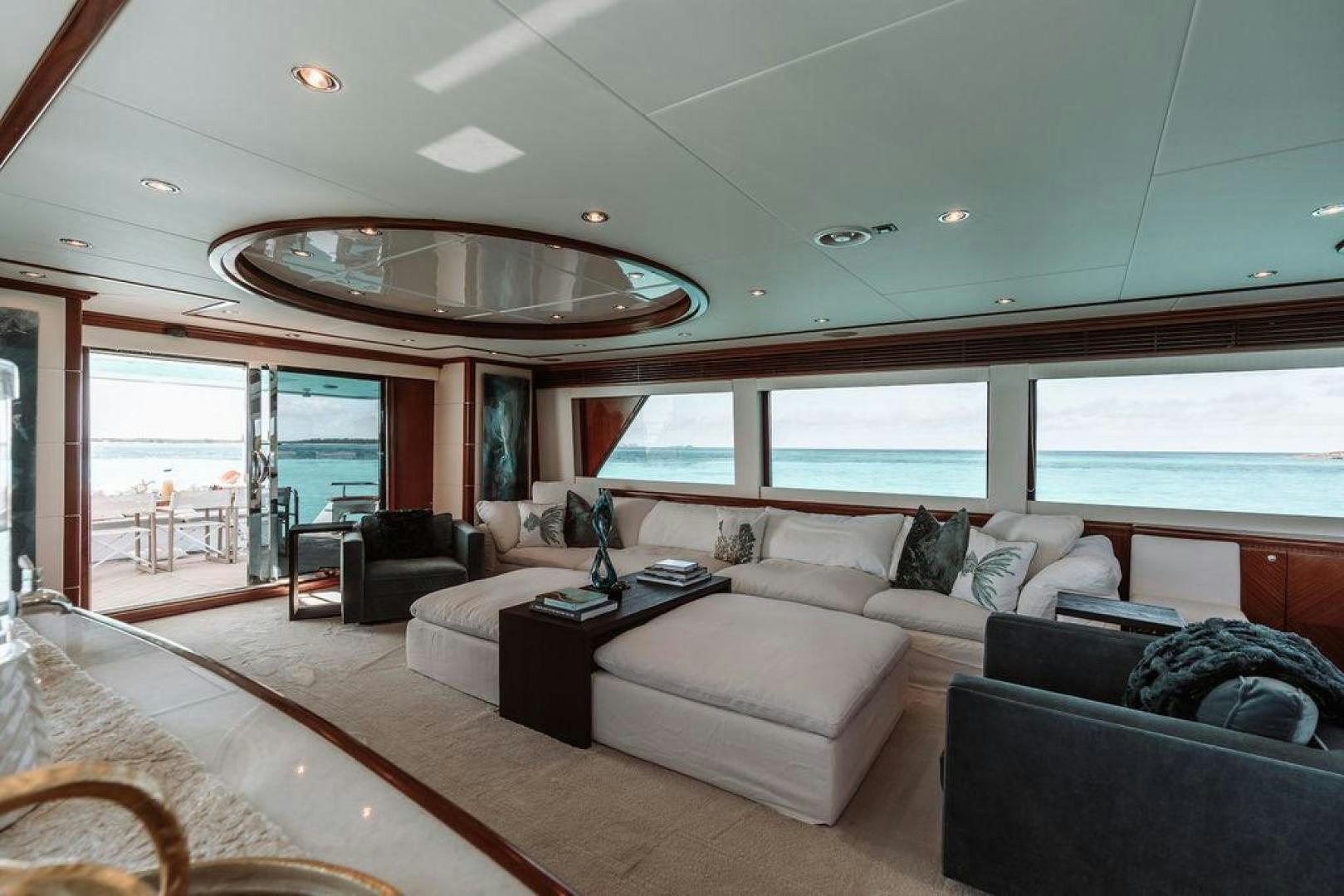 a living room with a large window aboard BEACHFRONT Yacht for Sale