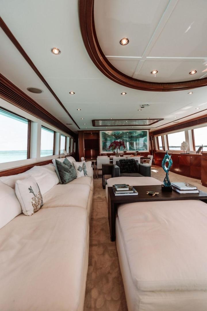 a living room with a couch and a coffee table aboard BEACHFRONT Yacht for Sale