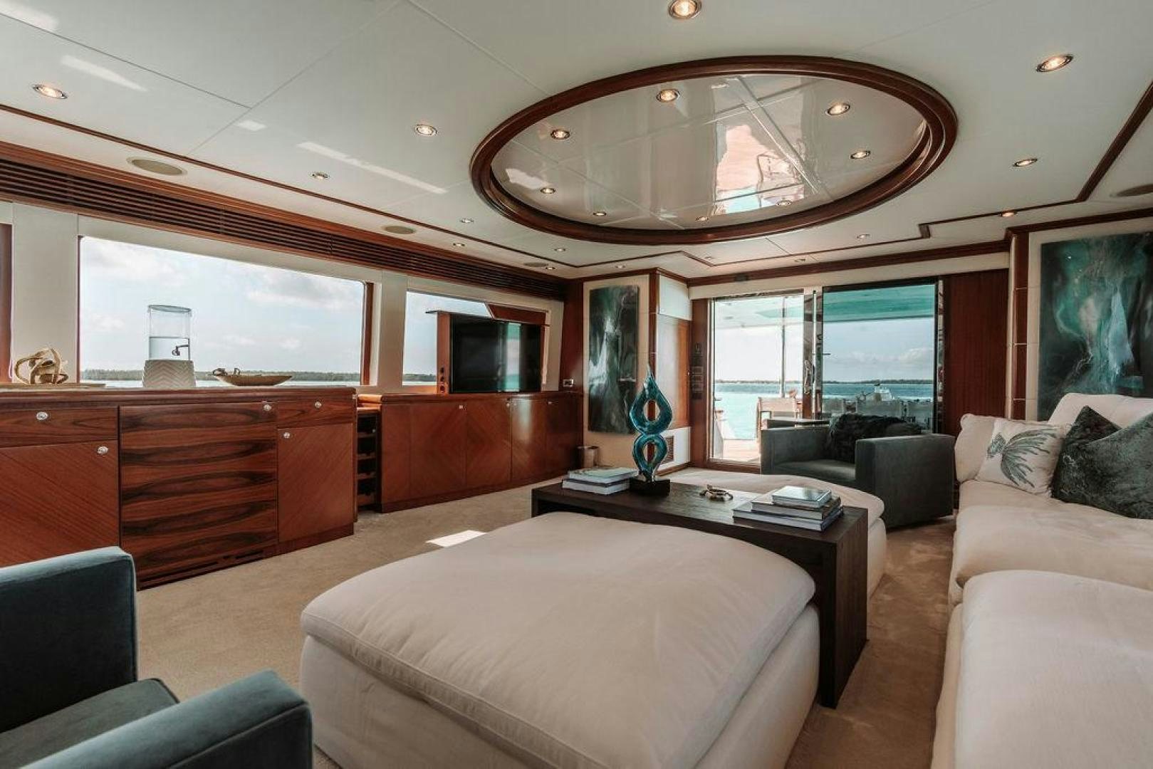 a living room with a large window aboard BEACHFRONT Yacht for Sale