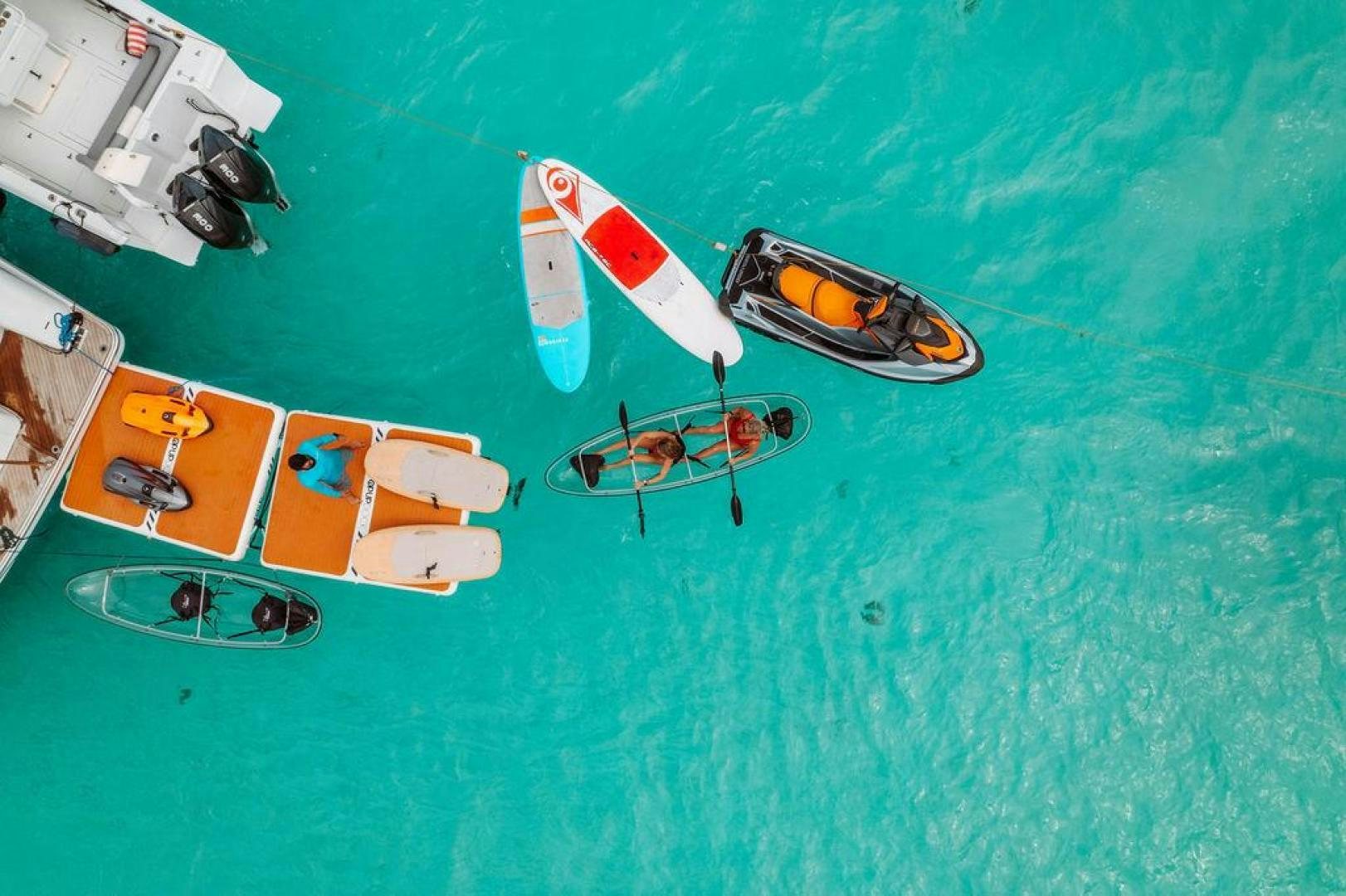 a group of boats on a body of water aboard BEACHFRONT Yacht for Sale
