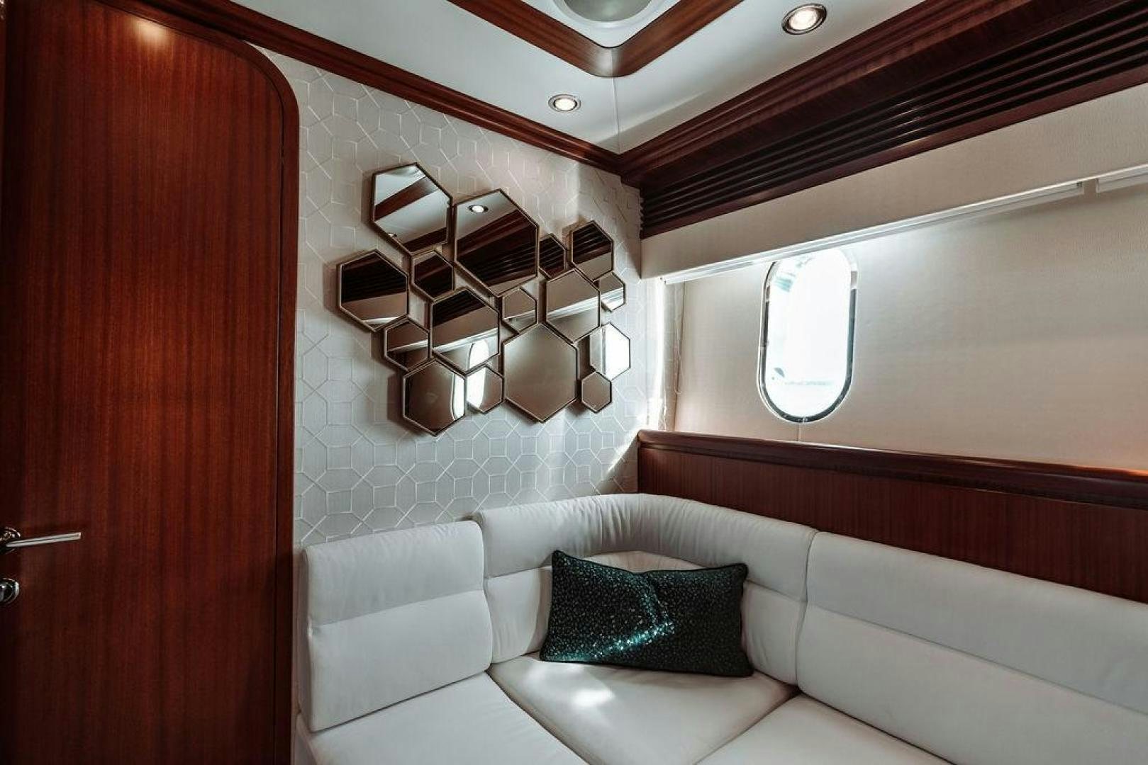 a room with a bed and a mirror aboard BEACHFRONT Yacht for Sale