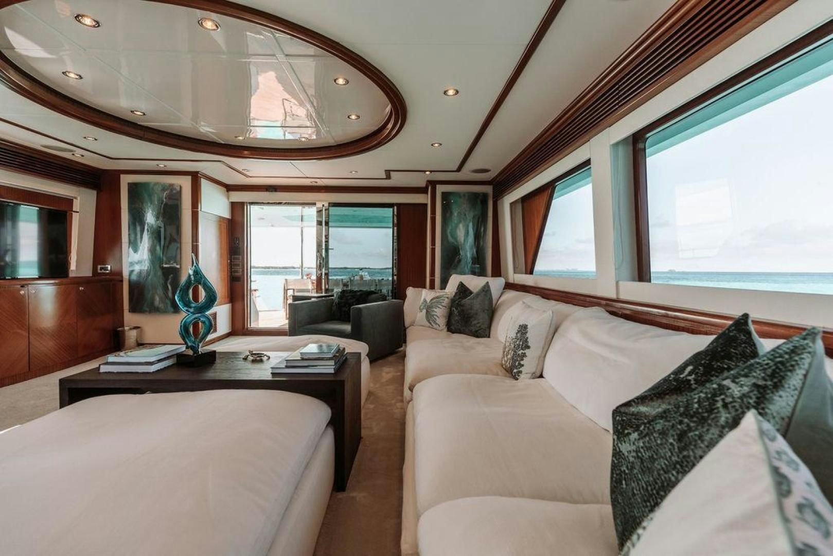 a living room with a large window aboard BEACHFRONT Yacht for Sale