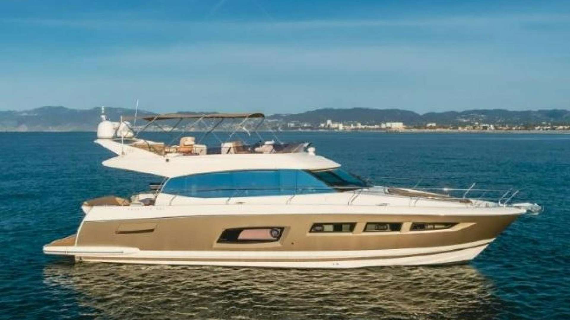 a white yacht in the water aboard BLUE SKY Yacht for Sale