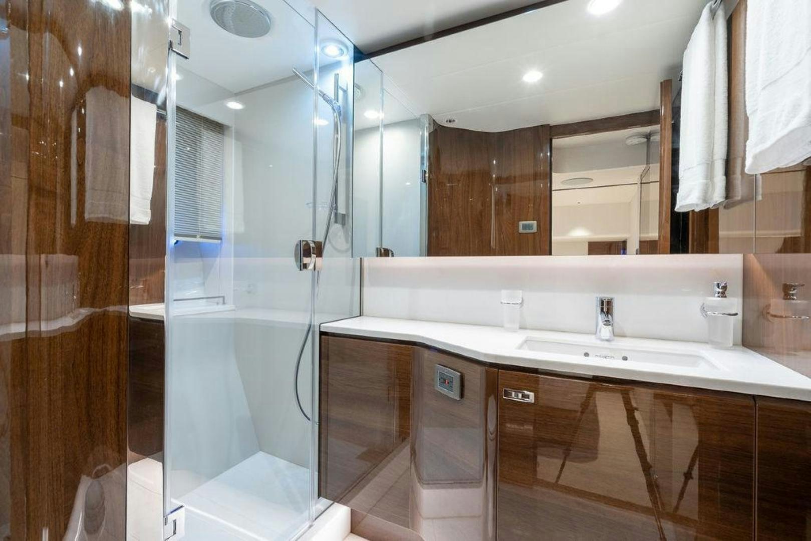 a bathroom with a glass shower aboard HIDEOUT Yacht for Sale