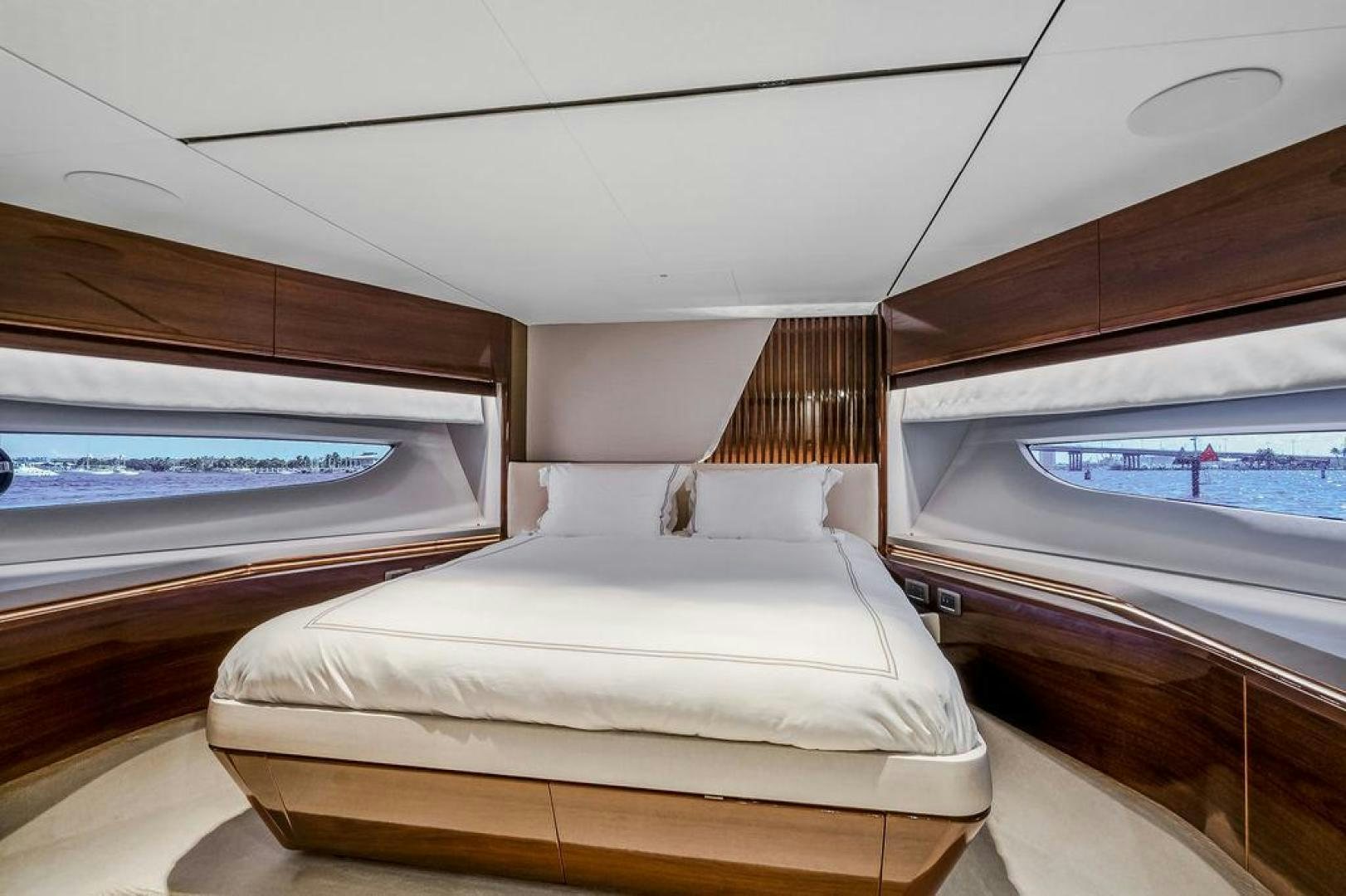 a room with a bed and a window aboard HIDEOUT Yacht for Sale