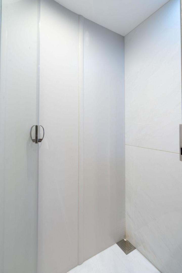 a white door with a handle aboard HIDEOUT Yacht for Sale