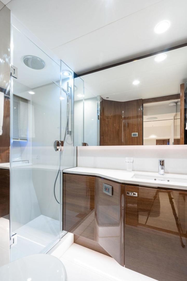 a bathroom with a shower unit and sink aboard HIDEOUT Yacht for Sale
