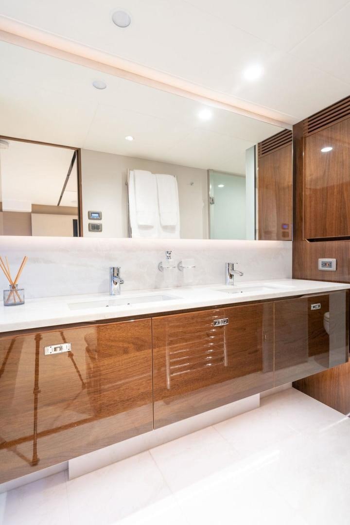 a bathroom with a large mirror aboard HIDEOUT Yacht for Sale