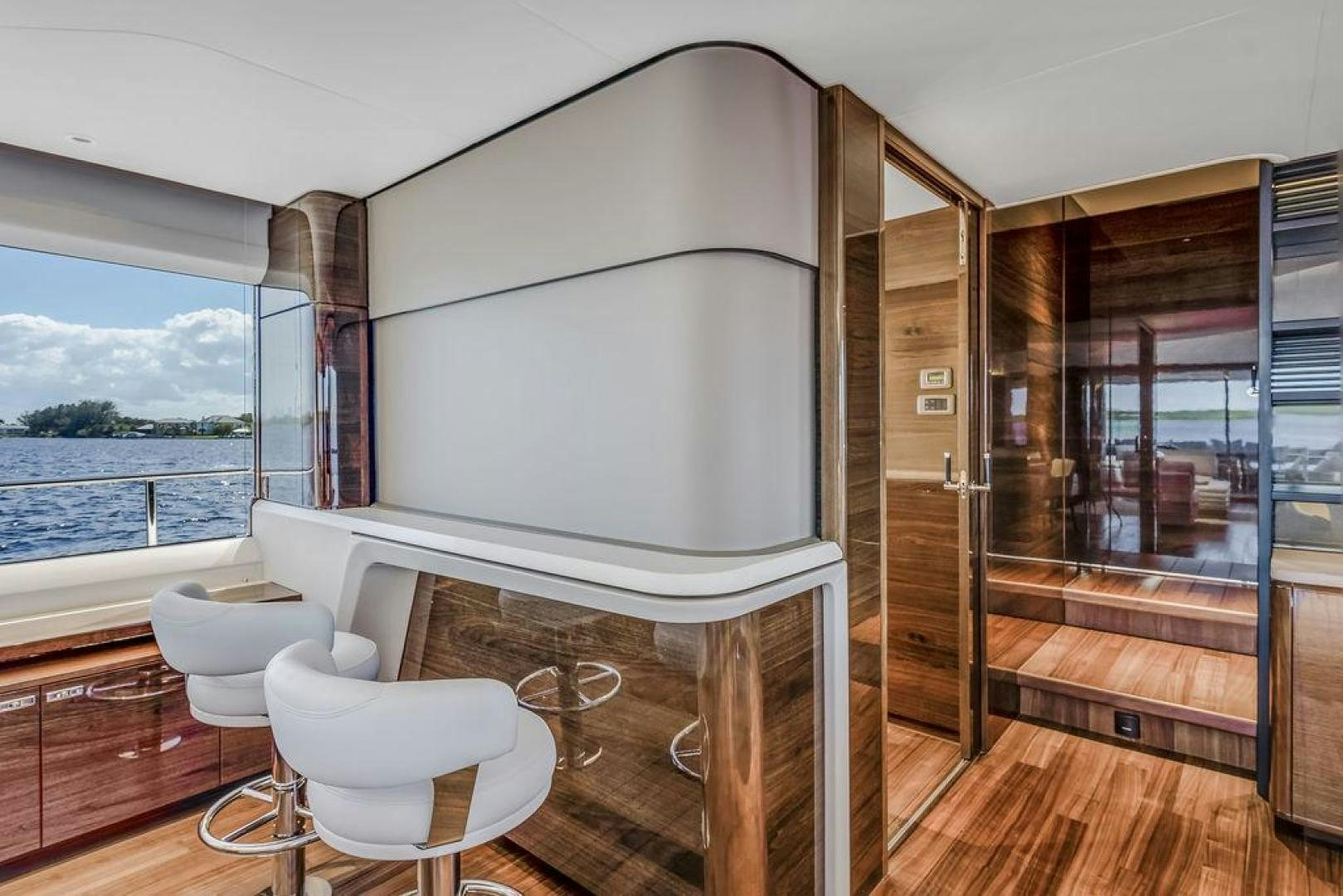 a room with a bed and a chair aboard HIDEOUT Yacht for Sale