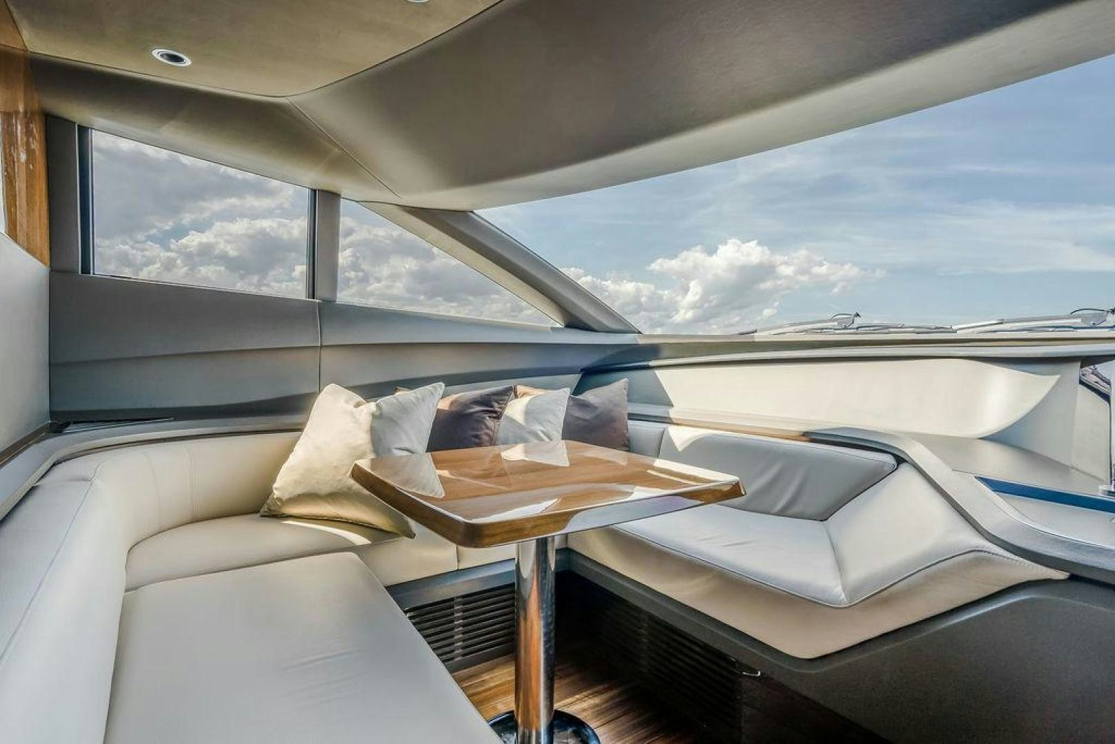 a room with a bed and a table aboard HIDEOUT Yacht for Sale