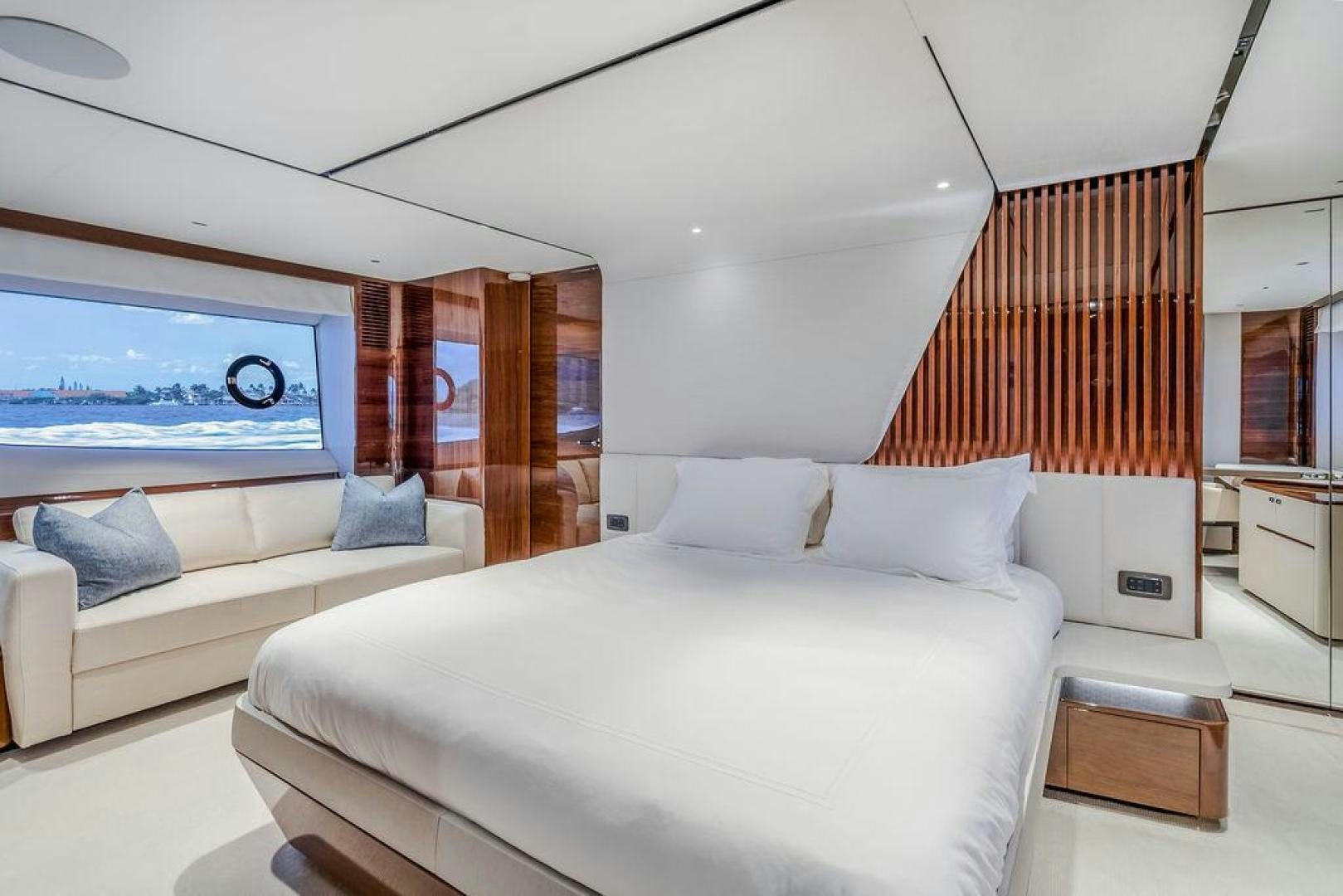 a bedroom with a bed and a television aboard HIDEOUT Yacht for Sale